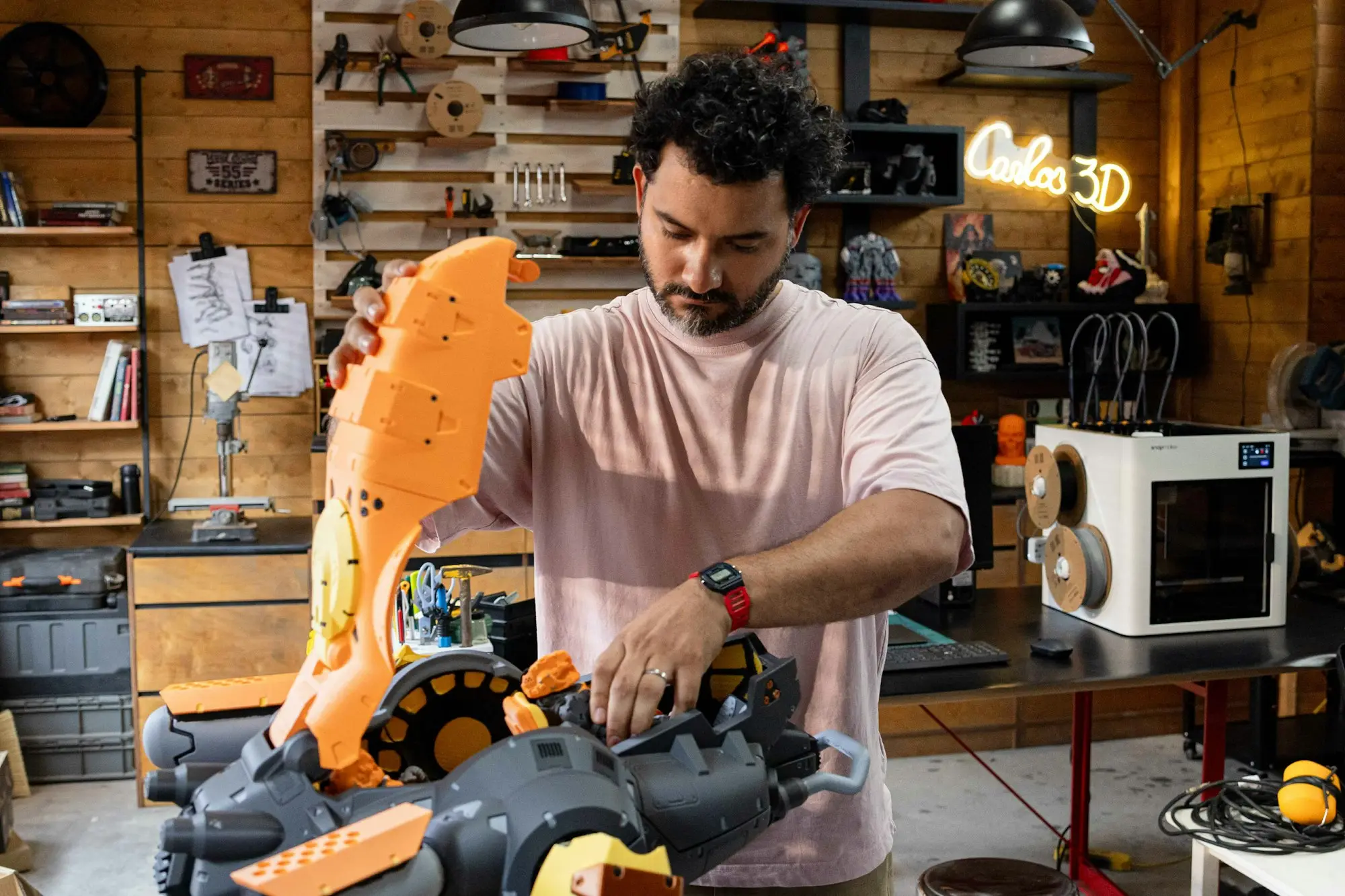Man assembling a large part in a workshop